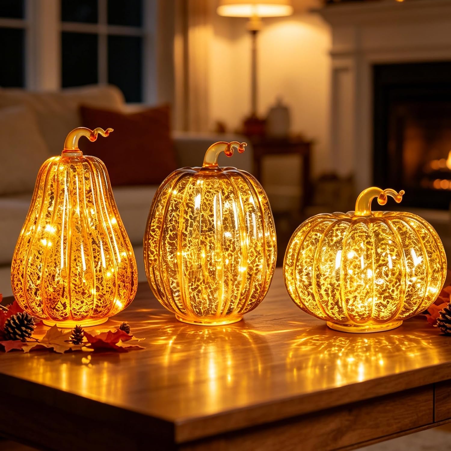 Set of three lighted mercury glass pumpkins in graduated sizes