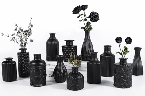 Set of 12 vintage etched black matte glass bud vases arranged as decorative centerpieces